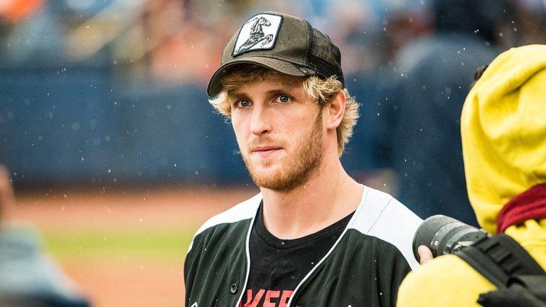 Logan Paul standing on a pitch.
